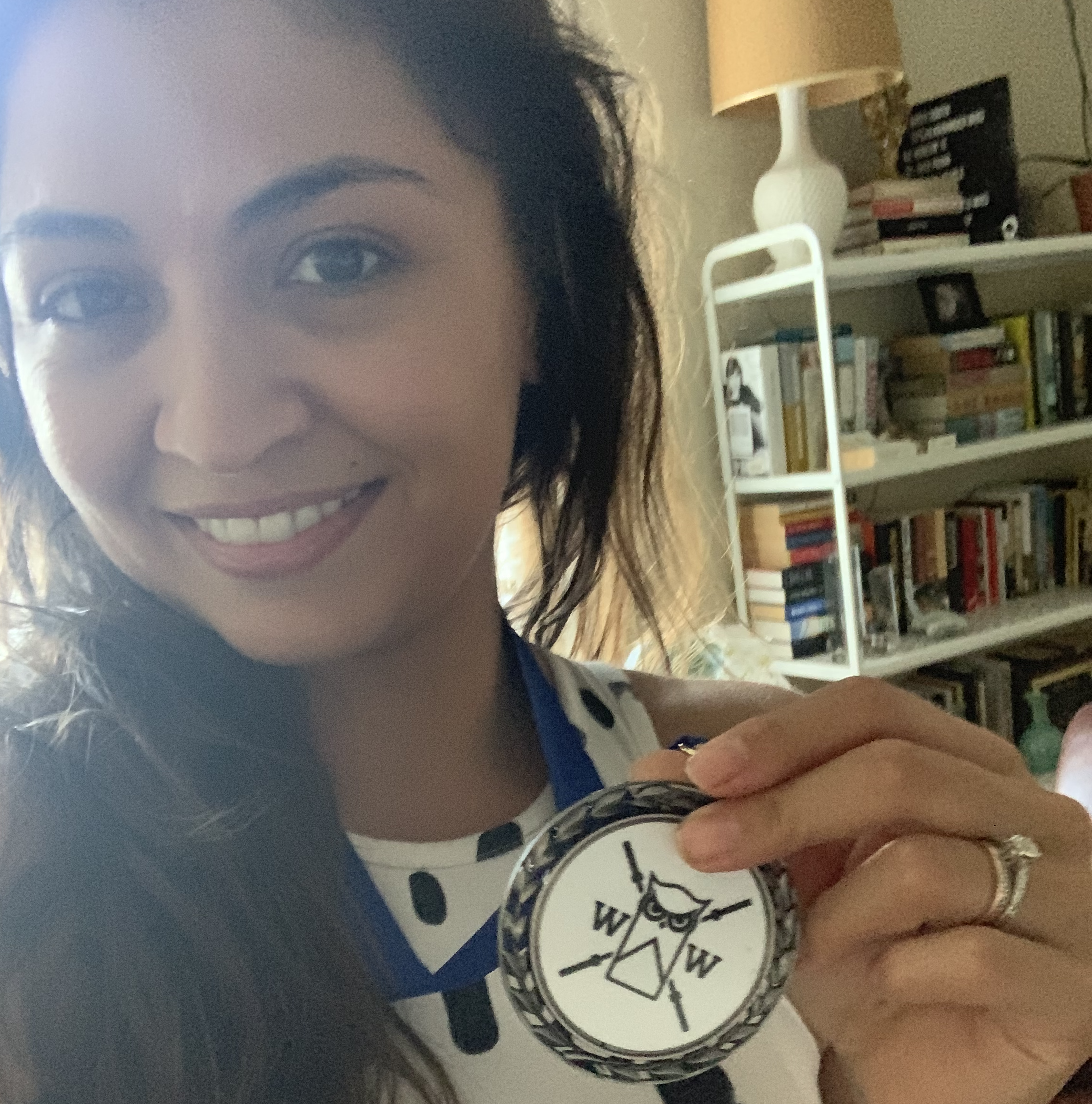 roni holding a weightlifting medal